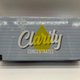 High-quality Clarity Shatter extracts in glass container for dabbing, showcasing a golden, translucent texture.