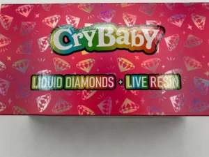 A CryBaby 2G disposable vape device, featuring its unique design and branding, showcased against a clean backdrop to highlight its vibrant colors.