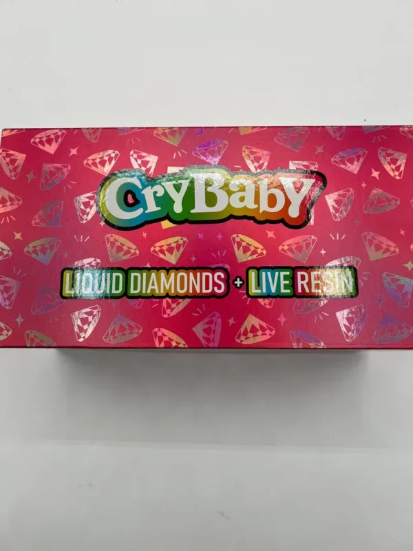 A CryBaby 2G disposable vape device, featuring its unique design and branding, showcased against a clean backdrop to highlight its vibrant colors.