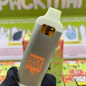 A Packman 2G Live Resin disposable vape device, featuring its eye-catching design and branding, placed on a stylish surface with a focus on its sleek appearance.