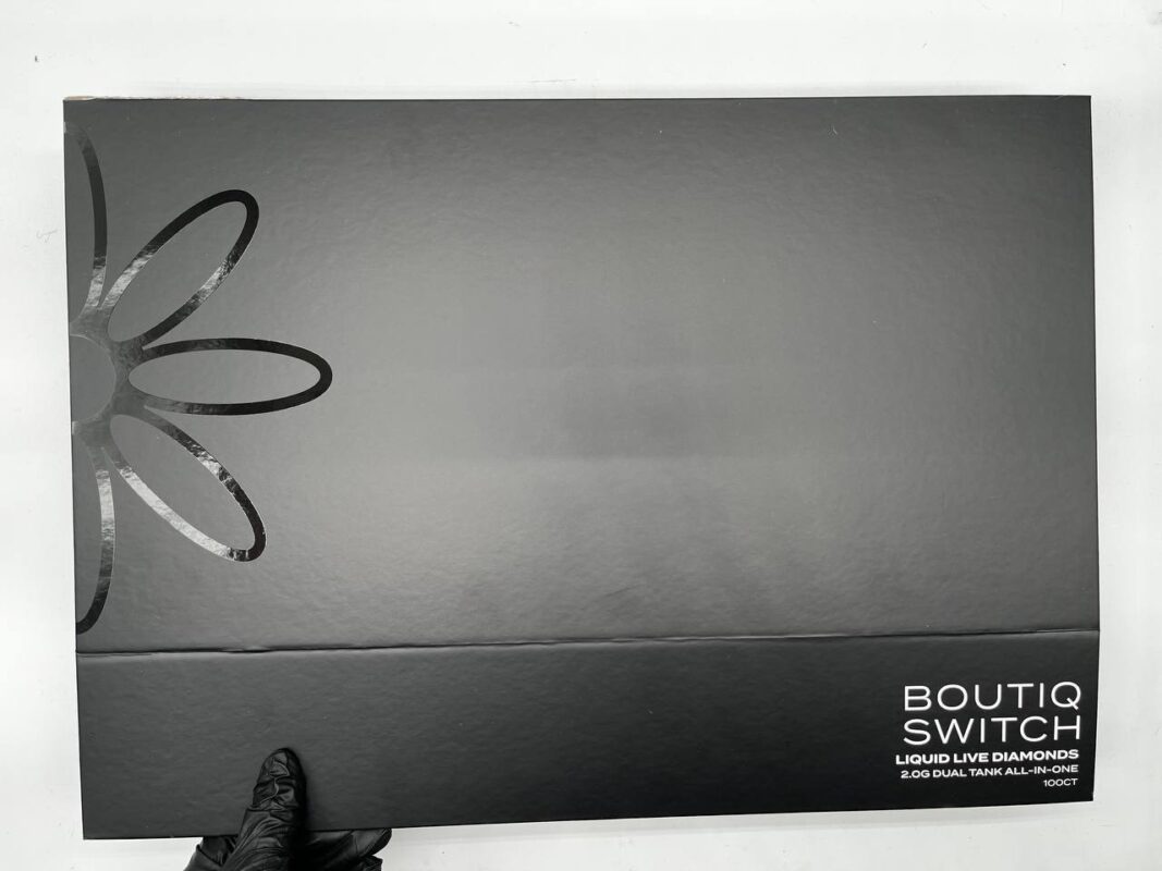 Boutiq Switch V4 2g Disposable vape pen with dual-strain chambers, LED display, and sleek matte black finish on a clean background.